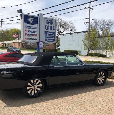 Black convertible car parked in front of