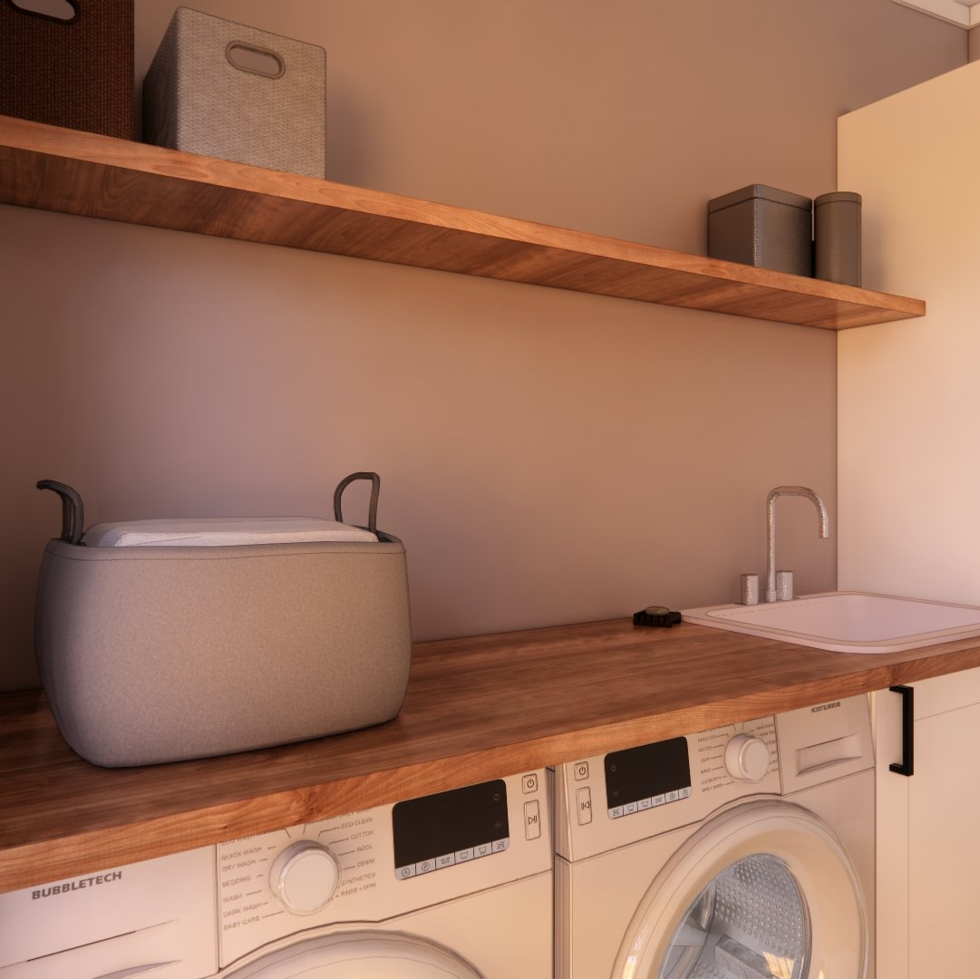 A laundry room with a washer and dryer and a sink