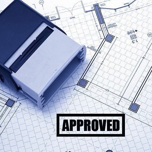 A blueprint with a stamp that says approved on it