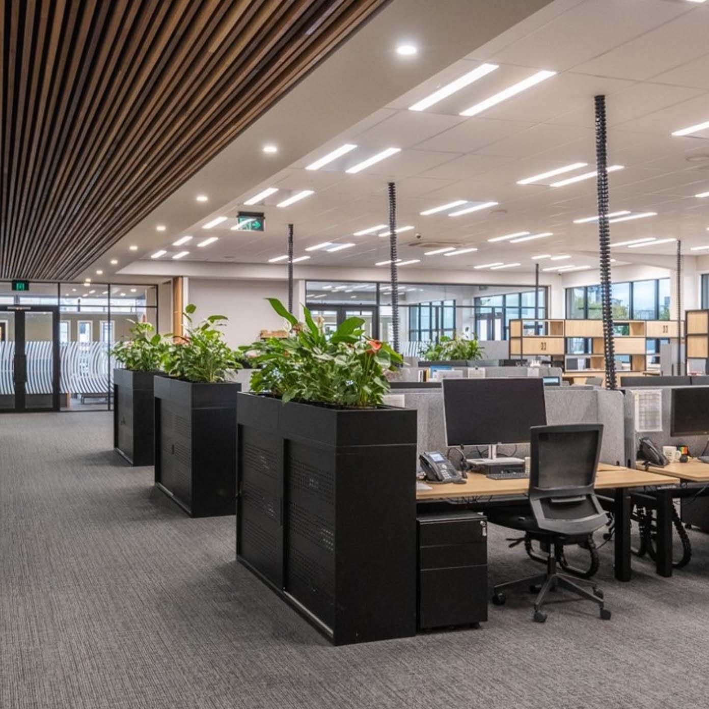 A large office with a lot of desks and chairs