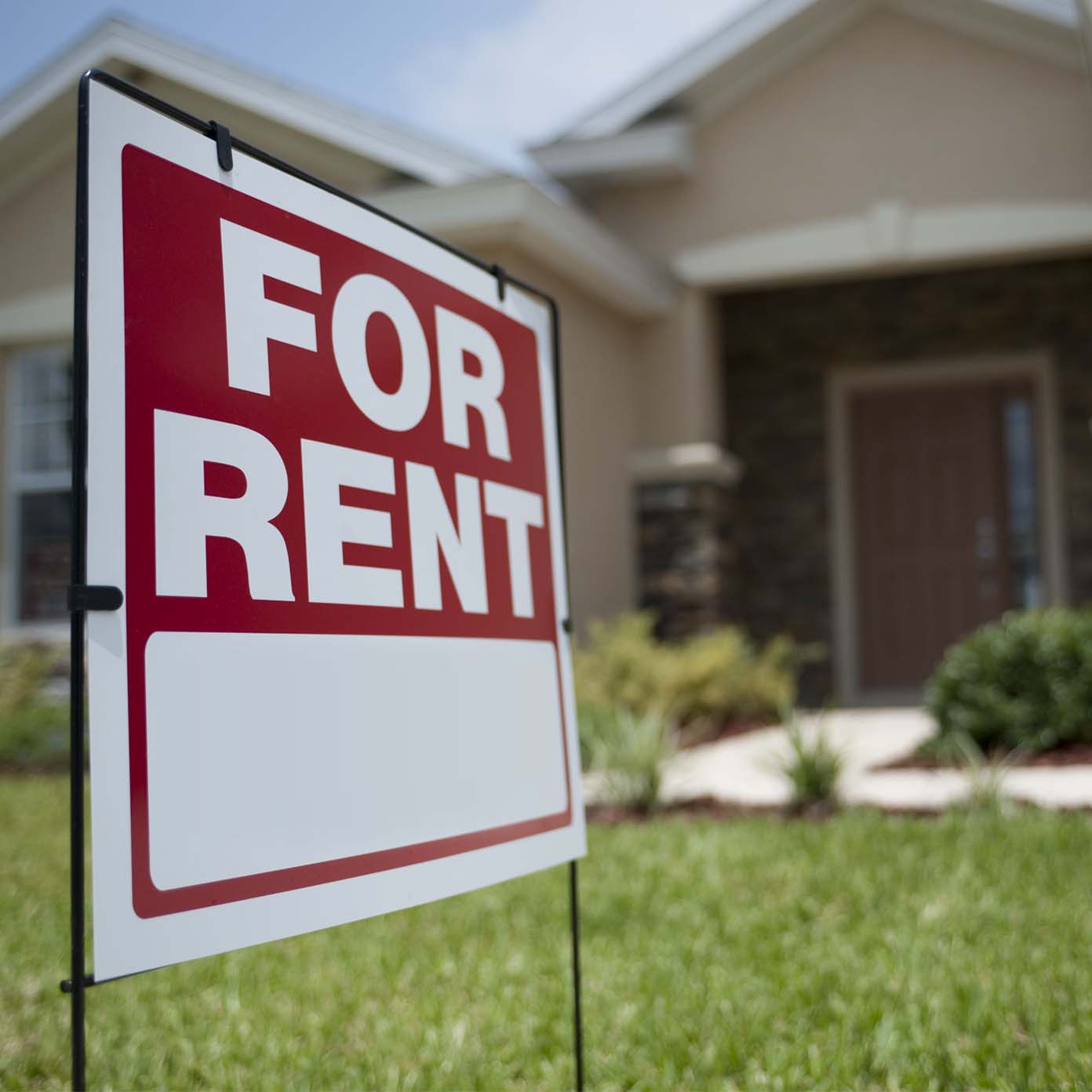 A for rent sign in front of a house