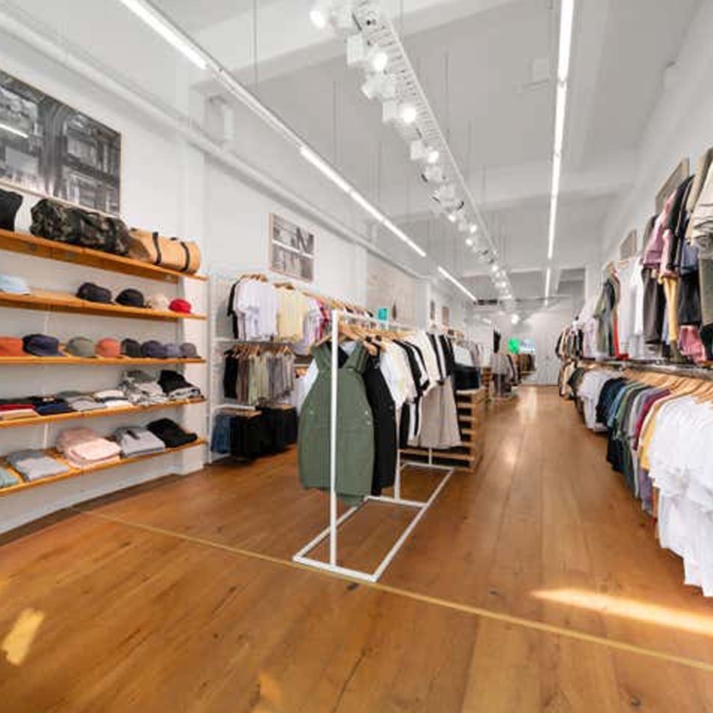 A clothing store with a lot of clothes on display