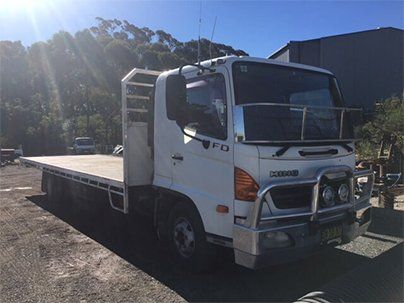 White Hino Flat Top Truck — Earthmoving & Excavation in Somersby, NSW