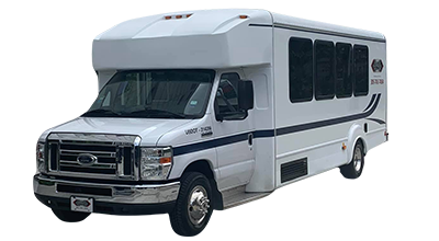 White passenger bus with black windows and trim.