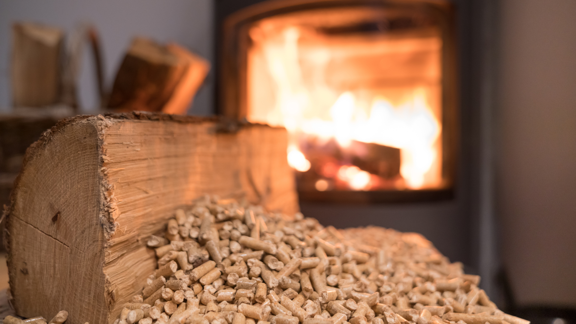 A pile of wood pellets is sitting in front of a fireplace.