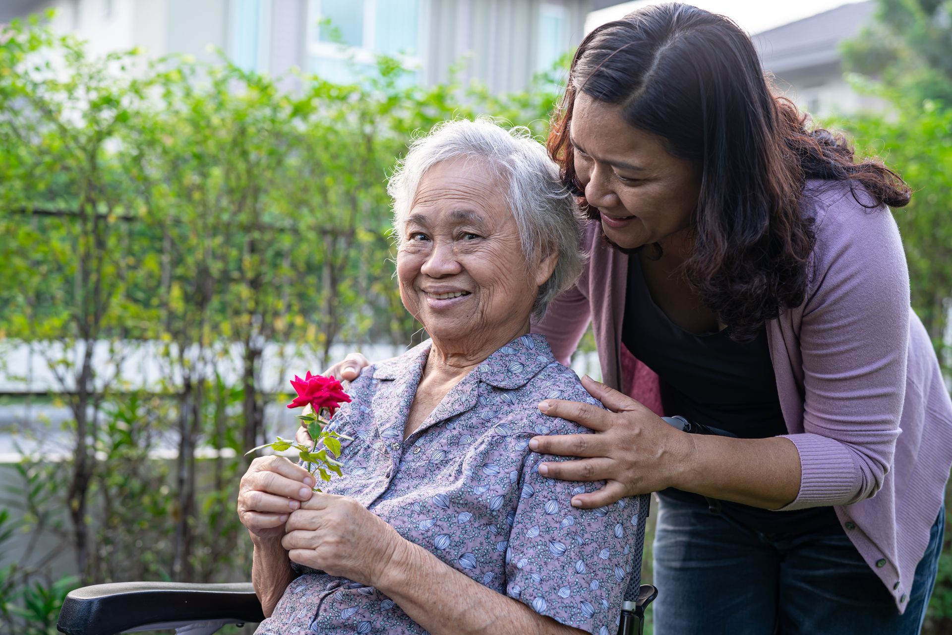 An elderly couple is sitting at a table with a Professional woman.
