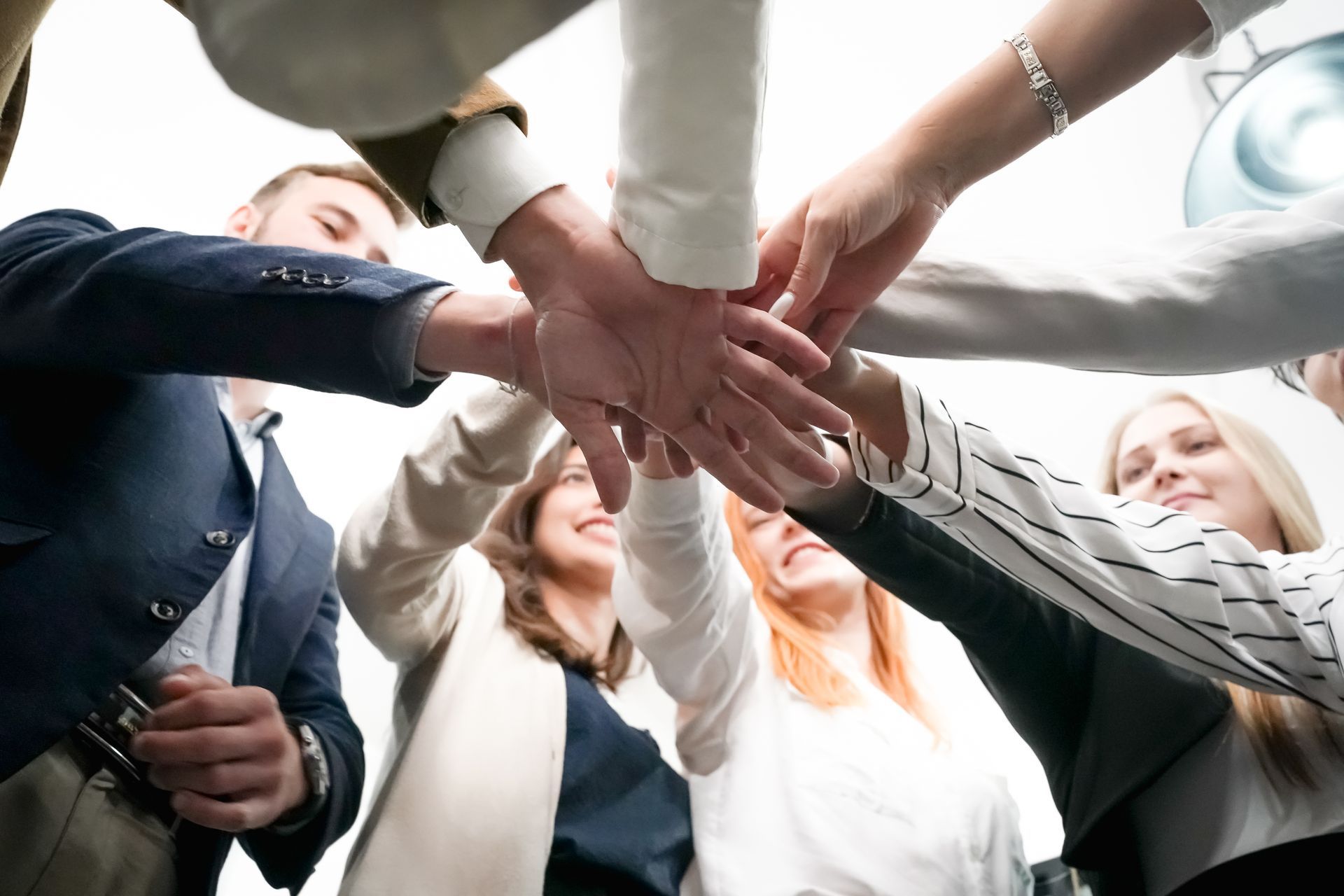 A man , a woman and a nurse are standing next to a dog Encouraging Mobility Solutions