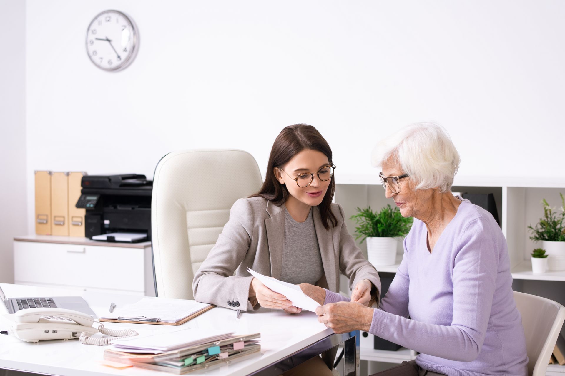 A doctor smiling at the camera who is a Primary Medicare Specialist