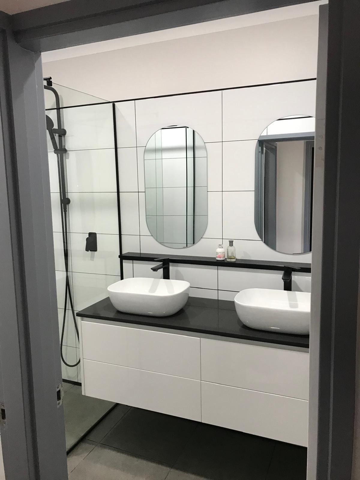 A Bathroom With a Sink and a Walk in Shower — Slim Fox Home Improvements in Mooroobool, QLD