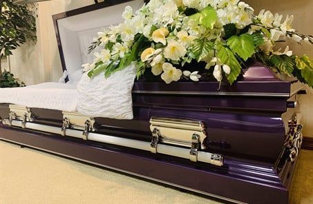 Several Photos of different caskets, gravestones, hearses, interior and exterior views of Kincannon Funeral Home in OK.