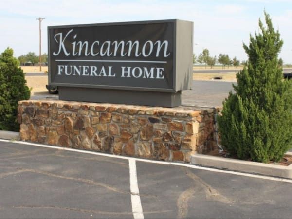 Several Photos of different caskets, gravestones, hearses, interior and exterior views of Kincannon Funeral Home in OK.
