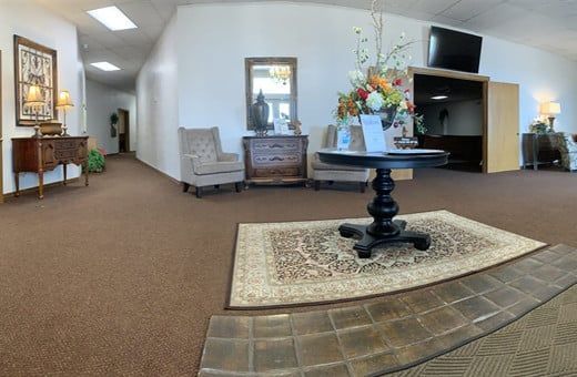 Several Photos of different caskets, gravestones, hearses, interior and exterior views of Kincannon Funeral Home in OK.