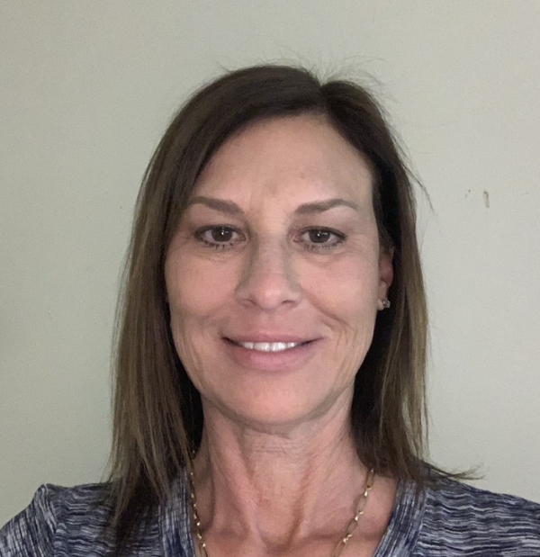 Crissy Caldwell, lead instructor, wearing a professional gray shirt