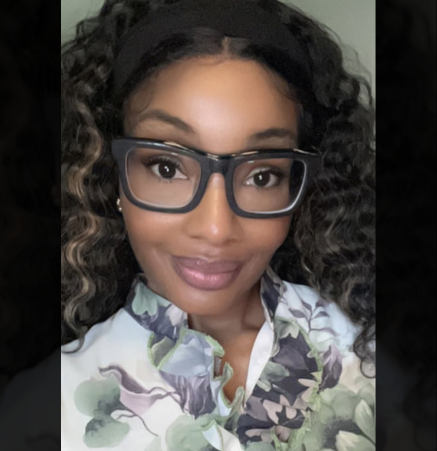 Regina Copeland, Hamilton County Instructor, wearing a floral professional outfit