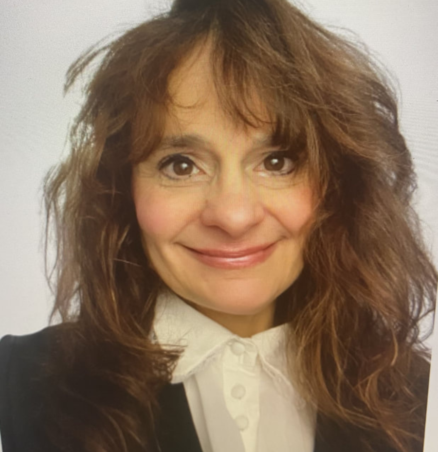 Lisa Truax, Rhea County ESL Instructor, wearing a black and white professional outfit