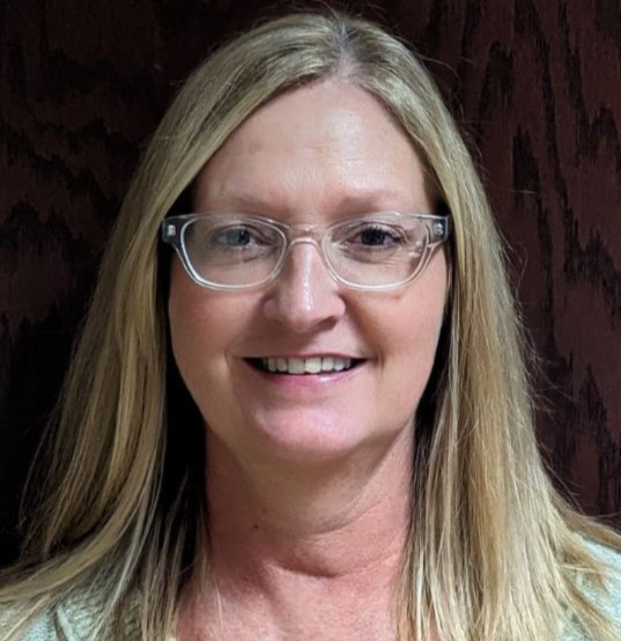 Connie Billingsley, Hamilton County student support specialist, wearing a green professional outfit