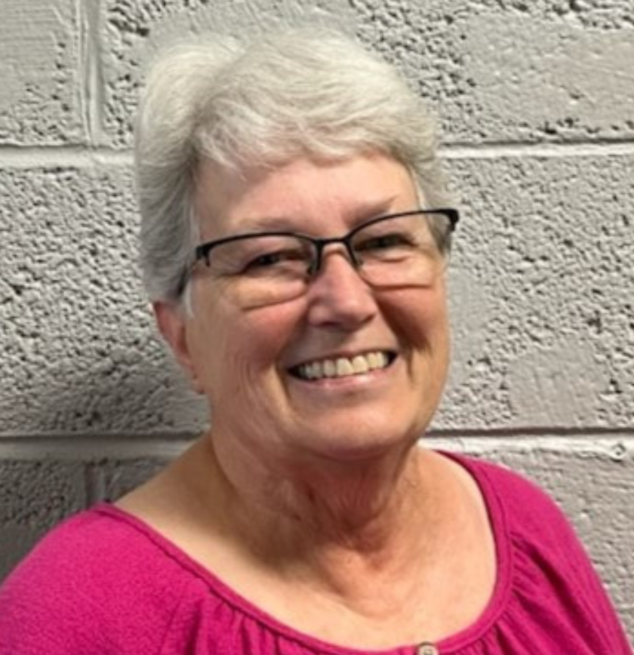 Pat Green, lead instructor and Sequatchie County instructor, wearing a pink professional outfit