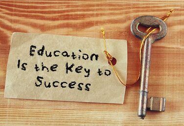 A key with a tag that says Education is the key to success.