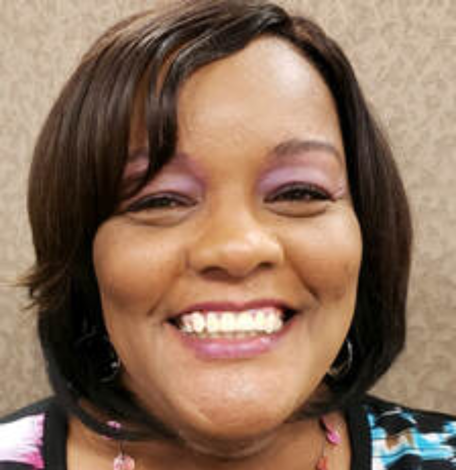 Sharon Benn, Hamilton Country student support specialist, wearing a multicolored professional outfit