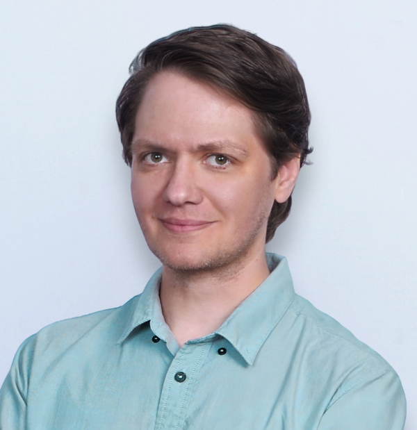 Jared Cochran, IT Coordinator, wearing a mint professional shirt