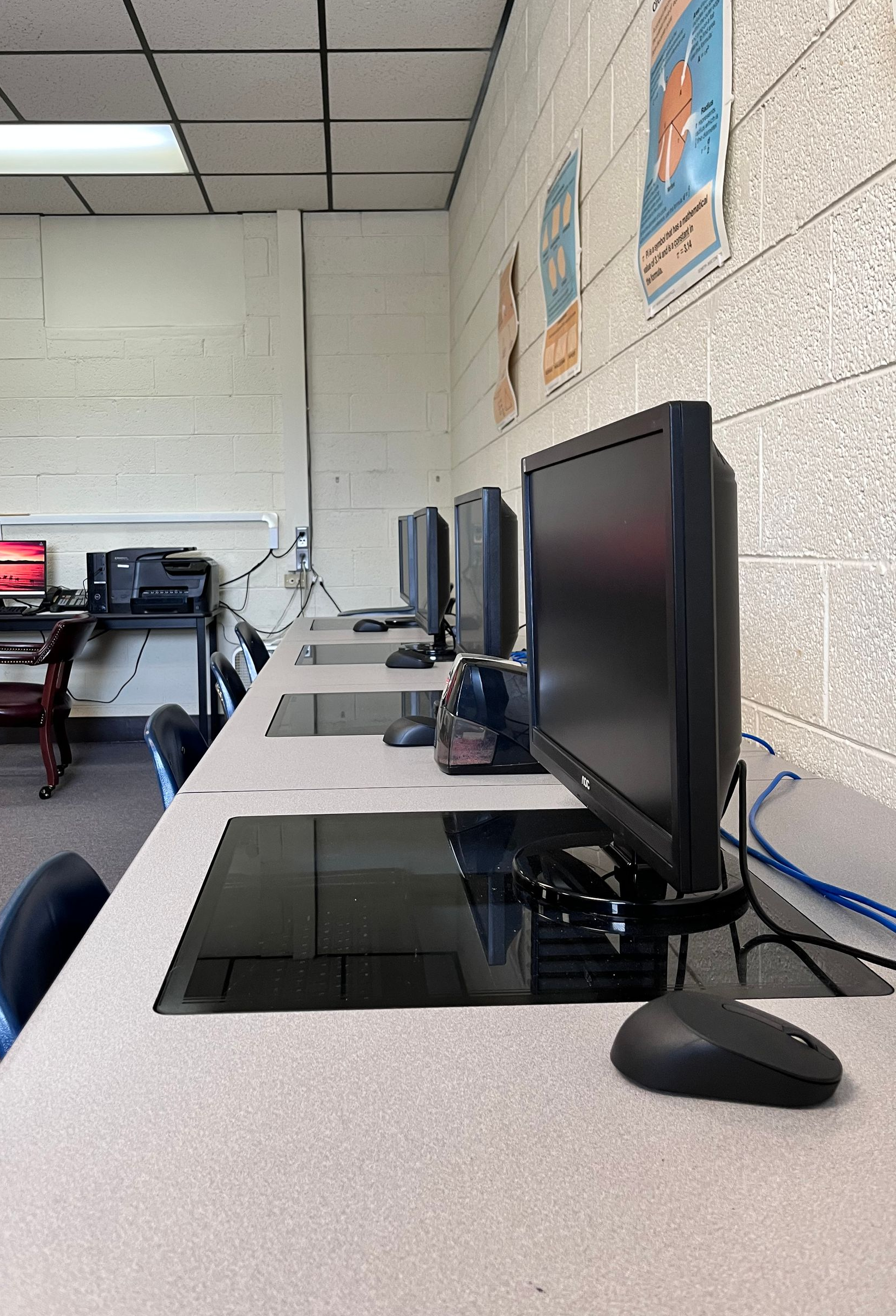 a row of classroom computers in a math classroom.