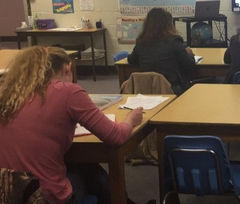 students in a classroom in adult education listening to an instructor