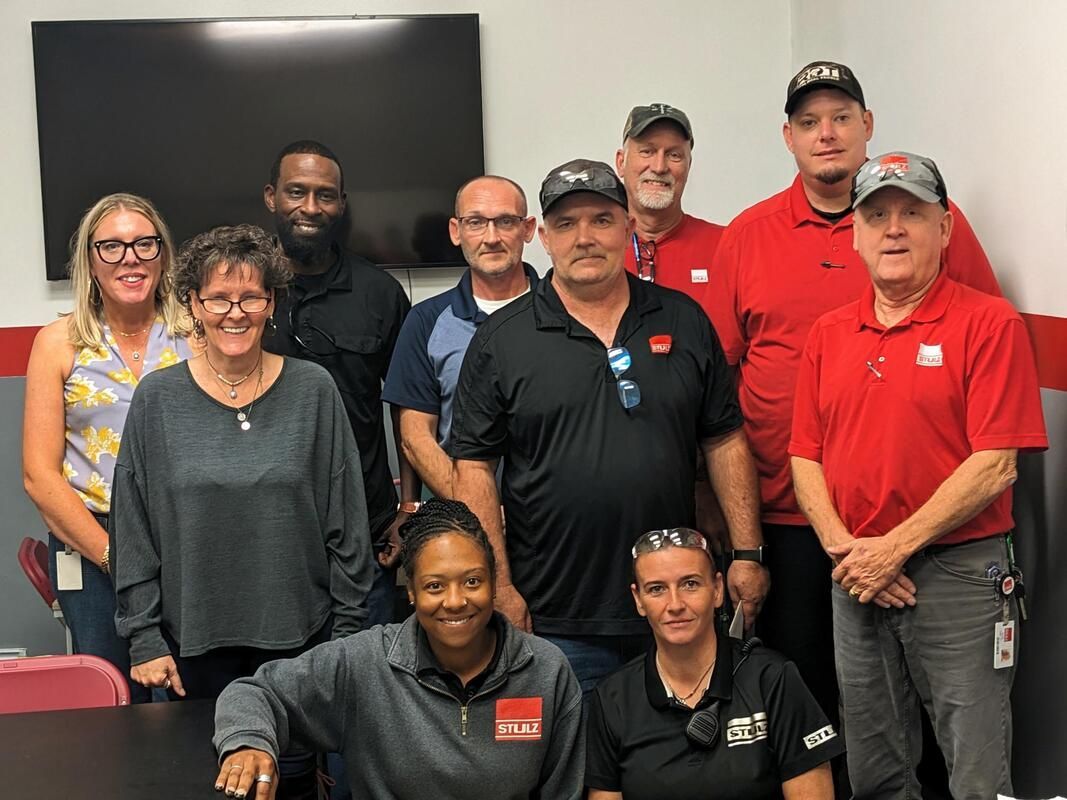 workers standing with instructors at Adult Education Southeast Tennessee.