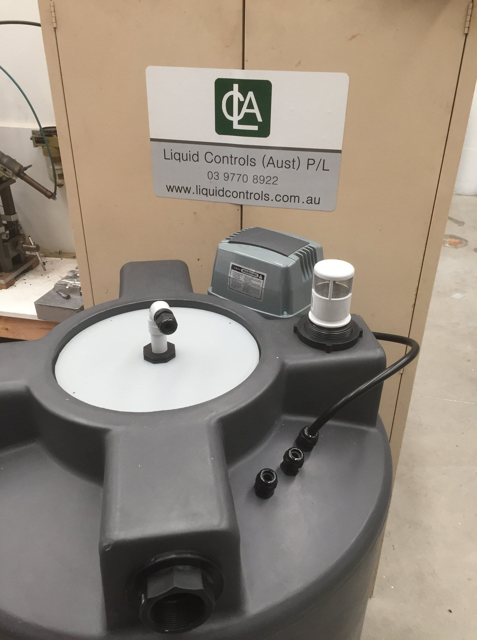 Chemical storage tank with level sensor.