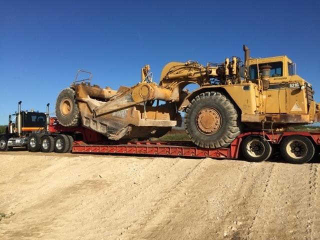Cat Scraper being hauled