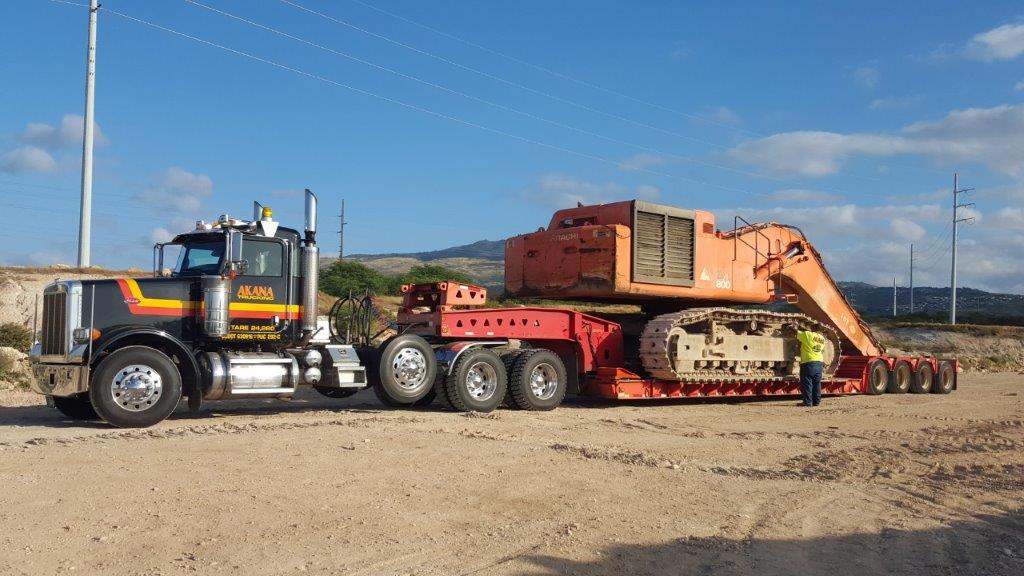 Semi Moving an Hitachi Excavator