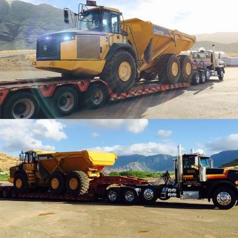 Heavy equipment being transported on a truck
