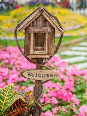 colorful garden with welcome sign