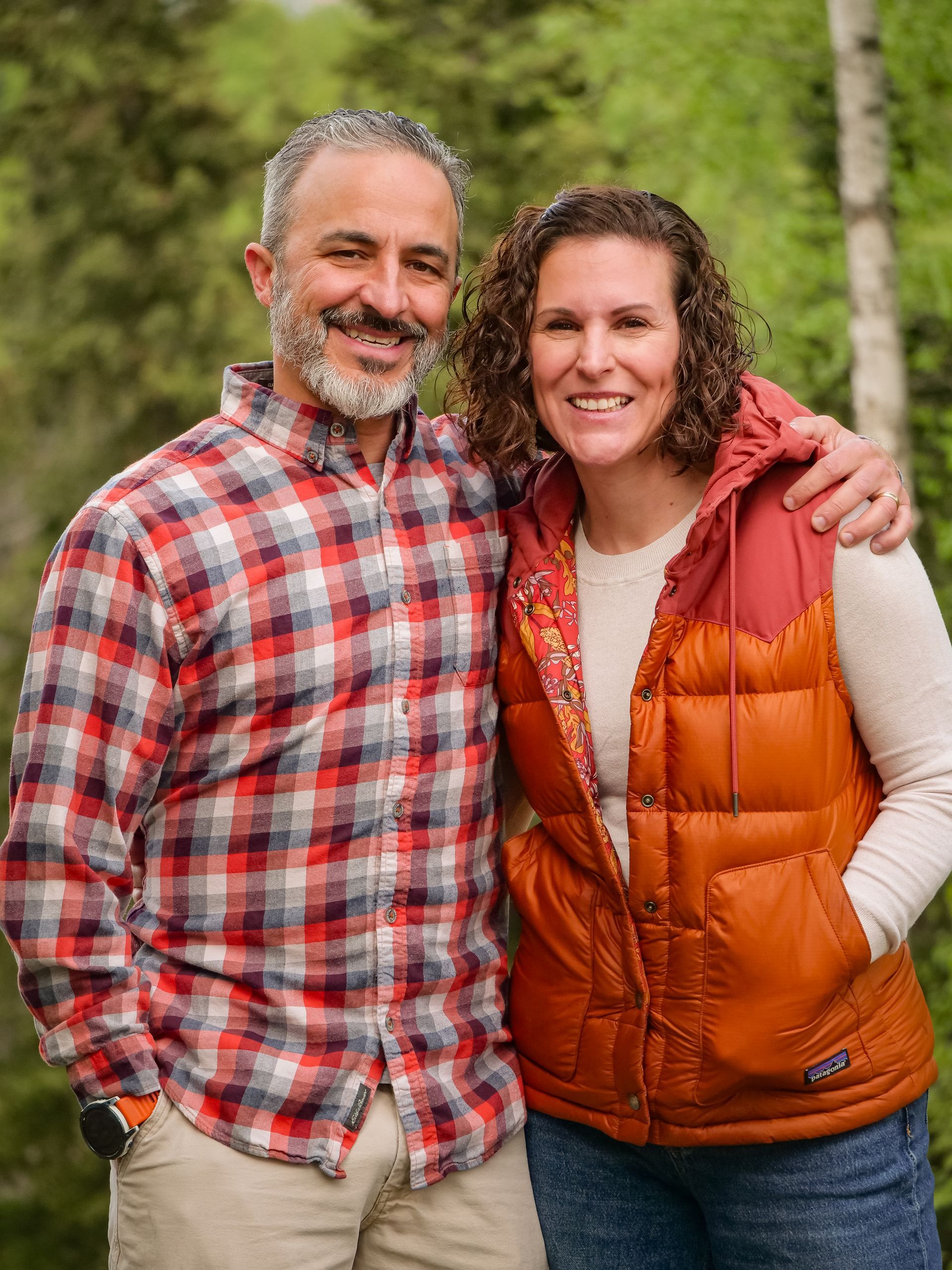 A close up of a person holding another person 's arm.