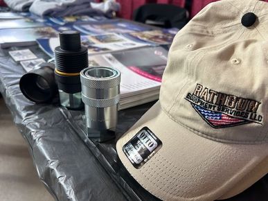 A hat that says patriot on it is on a table