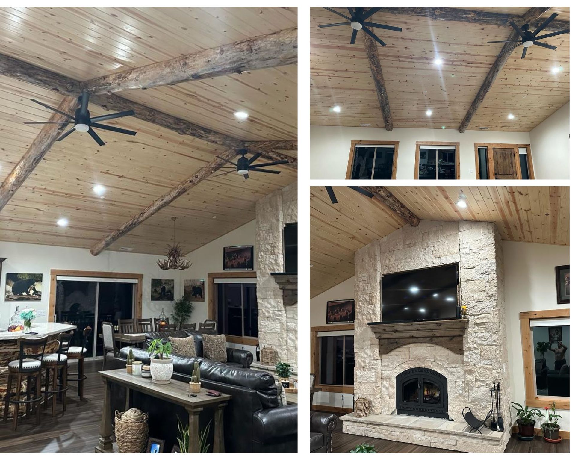 A rustic living room with a stone fireplace, wood beams, and a high ceiling with recessed lights.