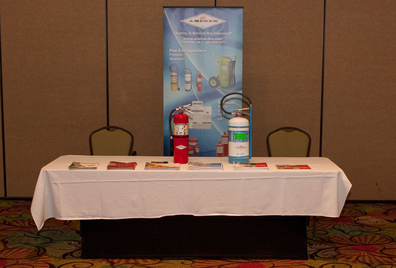 A table with a fire extinguisher on it