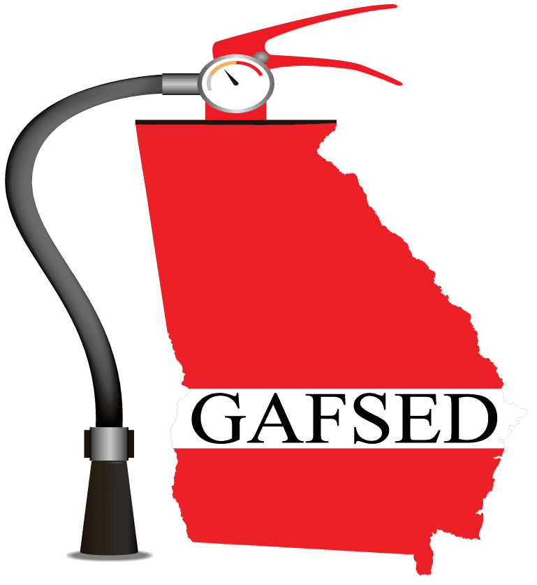 A red fire extinguisher is sitting on top of a map of georgia.