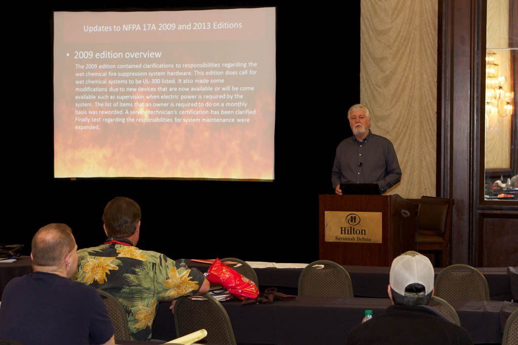 A man is giving a presentation to a group of people