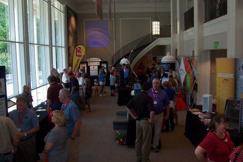 A large group of people are gathered in a large room