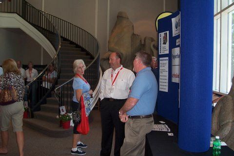 A group of people standing in front of a staircase