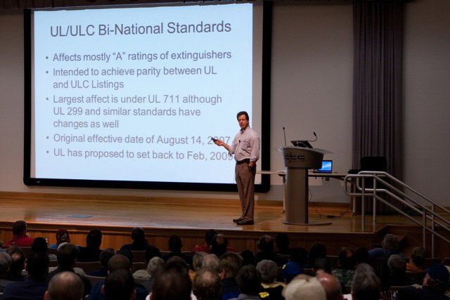 A man is giving a presentation on ul / ulc bi-national standards