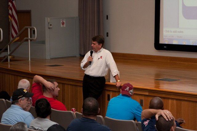 A man is giving a presentation to a group of people