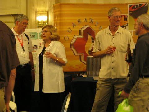 A group of people standing in front of a sign that says quark