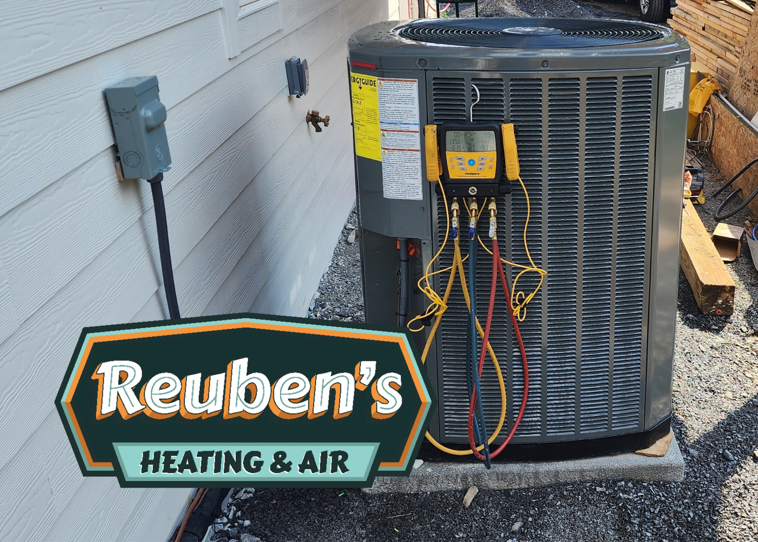 A reuben 's heating and air advertisement with a picture of an air conditioner