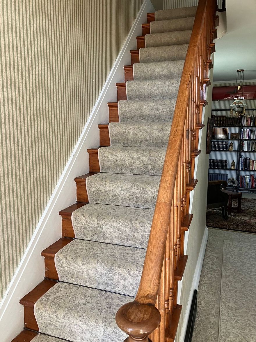 A sunset over a mountain range with a lot of fog