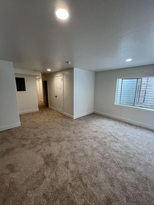 Finished living room with carpet