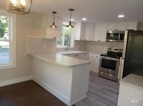 Simple kitchen with white finishes