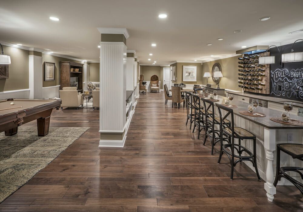 Gorgeous living room with brown hardwood floors and columns