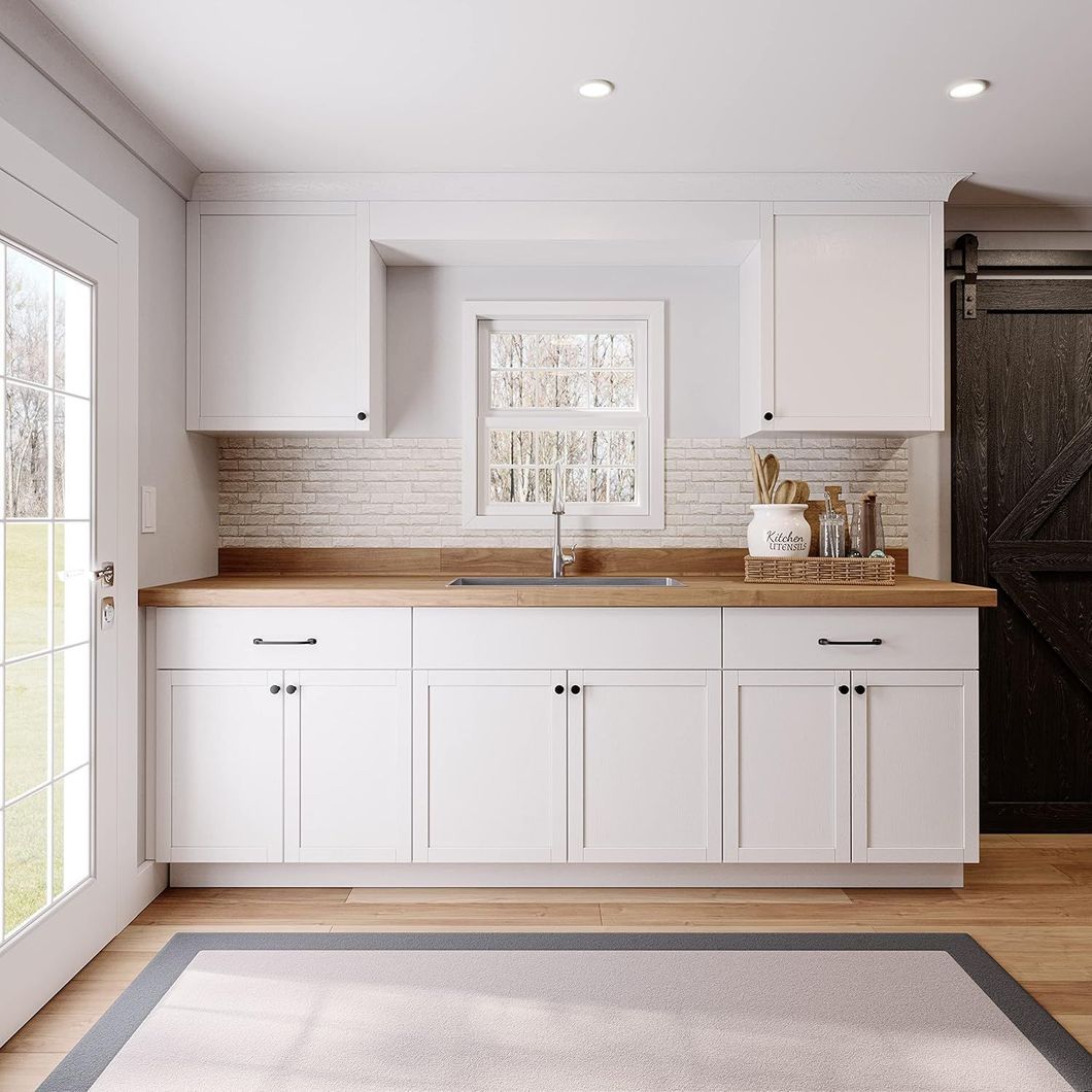 Kitchenette with wooden countertop.