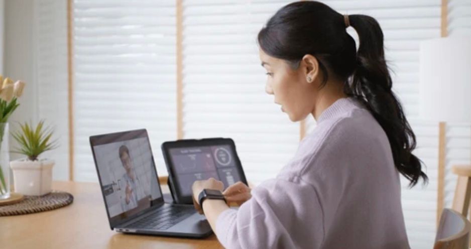 Woman talking with a doctor on her laptop during a telehealth visit